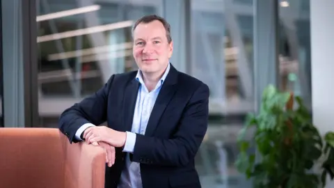 Andy Scott, UK Managing Director, Defence and Security, in a modern office