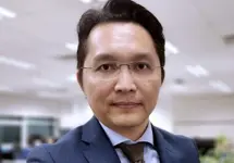 Portrait of Leo Leow, Country Director, Malaysia, in a modern office