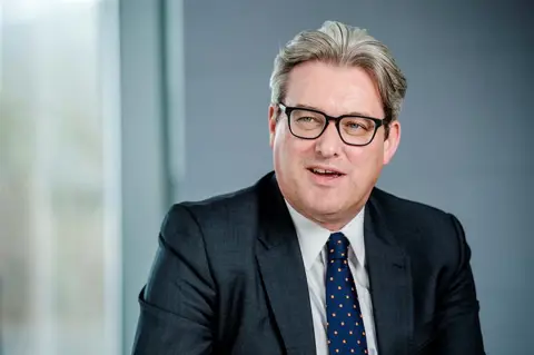 Portrait of Murray Rowden in an office